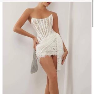 The viral lace corset mini dress. Never been worn brand new with tags. XS